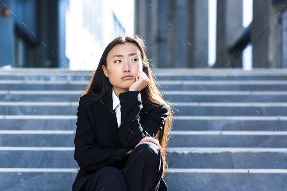 Sad asian woman fired from work sitting on the stairs Stock Photo by ...