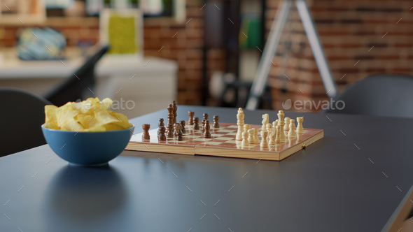 Nobody in living room flat to enjoy modern board games Stock Photo by