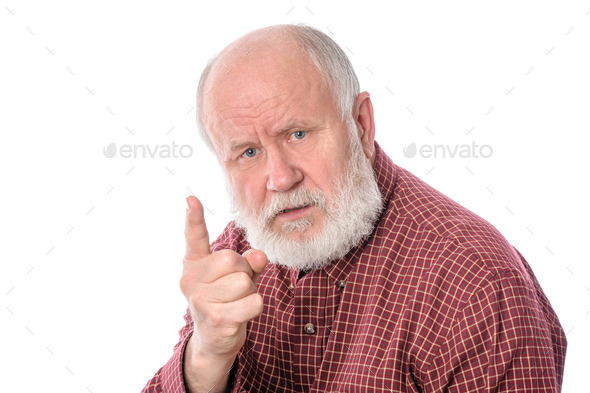 Senior man shows forefinger gesture, isolated on white
