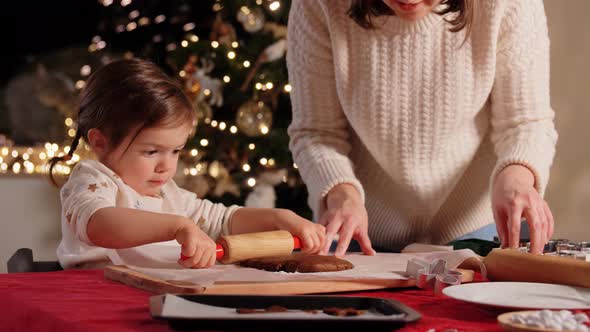 Mother and Daughter Making Gingerbread at Home alt