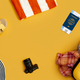 Flat Lay Shot Of Yellow Suitcase Unpacked With Holiday Accessories On Yellow Background - PhotoDune Item for Sale