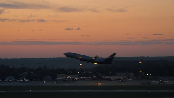 Airport with Plane Taking Off in the Dusk alt