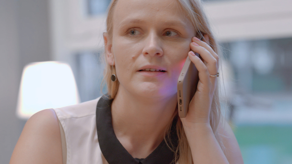 Woman Having Friendly Phone Conversation alt