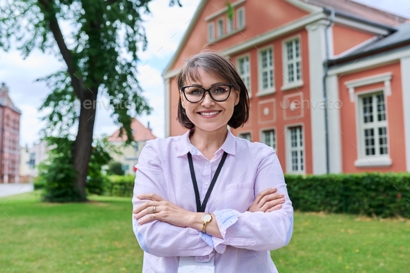 Education, social services, smiling confident female staff looking at camera - Stock Photo - Images
