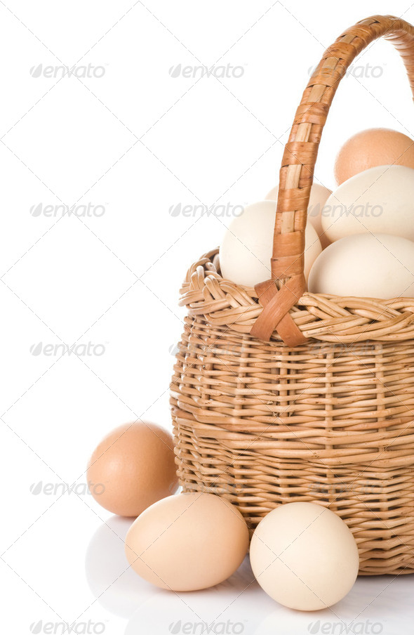eggs and basket isolated on white - Stock Photo - Images