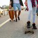 Portrait of happy teenager people having fun while driving a skateboard in city outdoors - PhotoDune Item for Sale