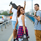 Group of happy teen people hang out together and enjoying skateboard outdoors - PhotoDune Item for Sale