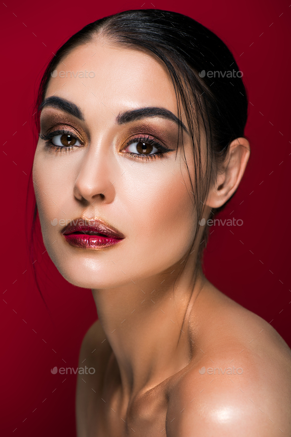 Portrait Of Beautiful Nude Girl With Makeup Isolated On Red Stock