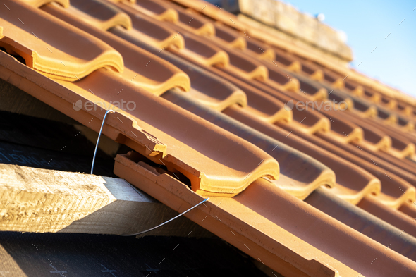 Closeup of metal montage anchor for installation of yellow ceramic ...