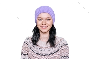 Portrait of young woman in hat in sweater on white isolated background