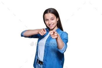 Beautiful teenage girl showing her index finger at you, on on white isolated background