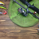 Fishing tackle. Float, wobbler, bait hooks, on a wooden background.  Selective focus Stock Photo by solovei23