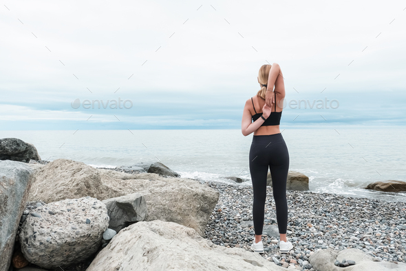 sport fit outdoor sea.girl goes sports,fitness,yoga seashore.Meditation, relaxation, mental health