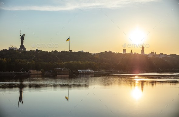 View of Kyiv from left bank of Dnipro river at sunset - Stock Photo - Images