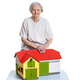 Smiling senior woman with a toy farm over white - PhotoDune Item for Sale