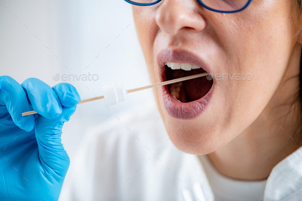 Taking a mouth swab for DNA analysis
