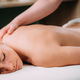 Back massage in a massage salon, woman having a relaxing back massage. - PhotoDune Item for Sale