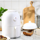 White Mini Air Fryer for Healthy Cooking in the Kitchen. White Kitchen  Concept Stock Photo by ikadapurhangus