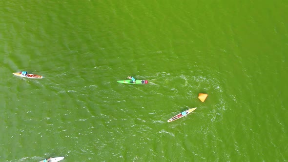 Aerial View of a Sup Boarding Competition on a Pond at Noon on a Summer Day alt