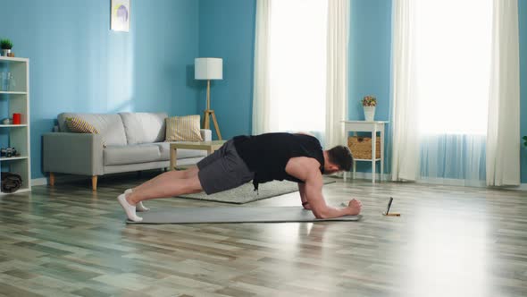 Athletic Man Practices Different Planks alt