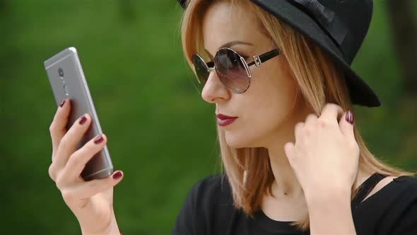 Hipster Girl  Looking In Smartphone