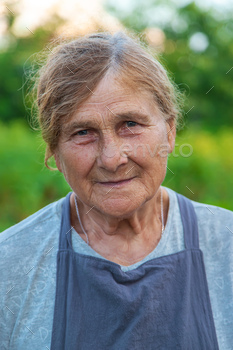 Portrait of a grandmother in the garden. selective focus.