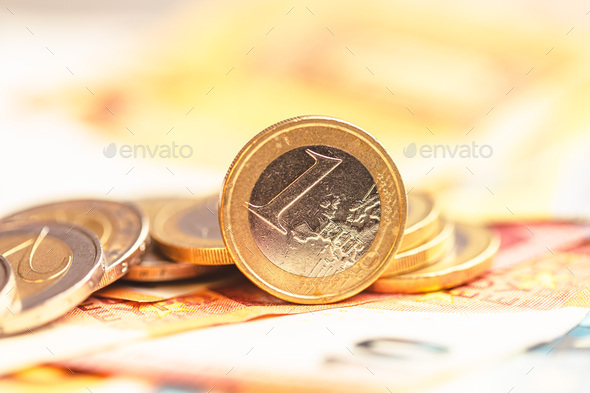 Euro coins on paper euro banknotes - Stock Photo - Images