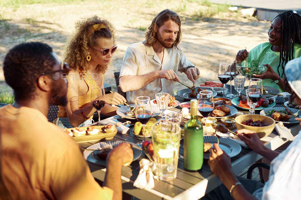 Diverse Group of Friends at Outdoor Dinner Party