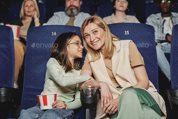 Mom And Daughter At Cinema