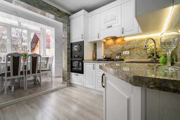 Modern classic white kitchen interior with dining zone Stock Photo by ...