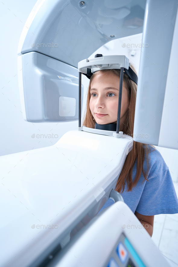 Calm patient is getting digital panoramic x-ray