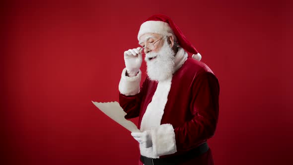 Portrait of Santa Claus Reading Letter alt