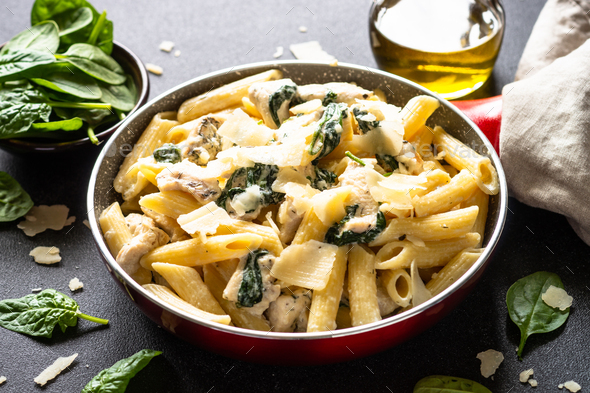 Pasta penne with chicken and spinach in creamy sauce. Stock Photo by ...