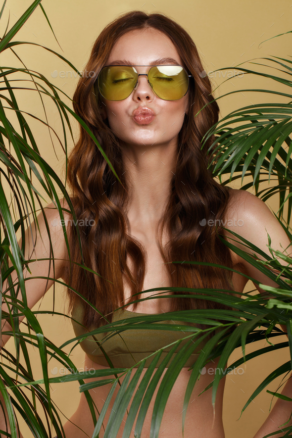 woman in bikini, green plants. Stock Photo by Kobrinphoto PhotoDune