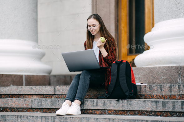 Student loan, Student finance for undergraduates. Outdoor portrait of student girl
