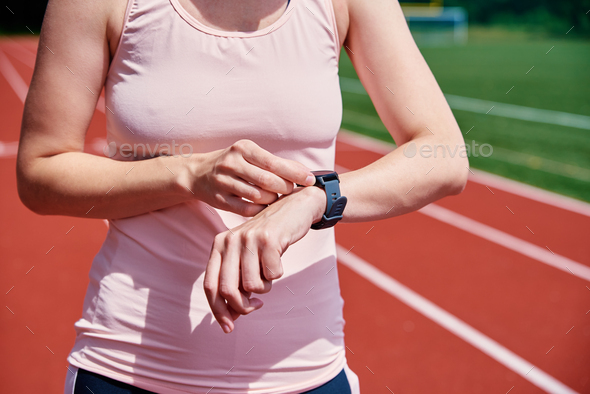 Woman use fitness smart watch, checking results after sport training