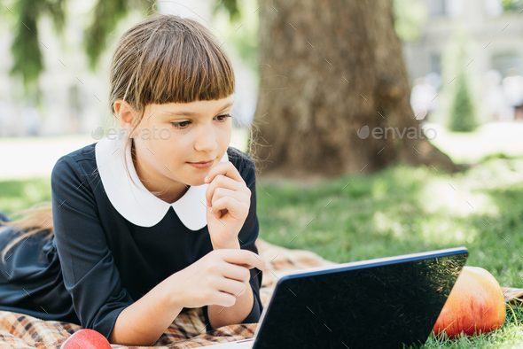 child with laptop computer. girl using pc. Life online. Surfing internet. Information source.