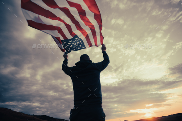 Man holding a waving american USA flag. Stock Photo by erika8213 ...