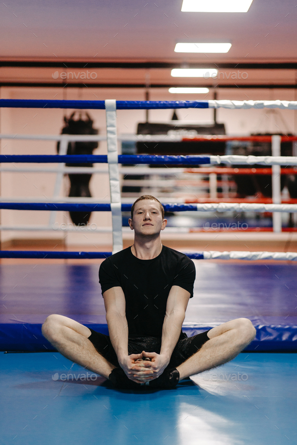 Boxers train in the ring and in the gym Stock Photo by yavorandriy