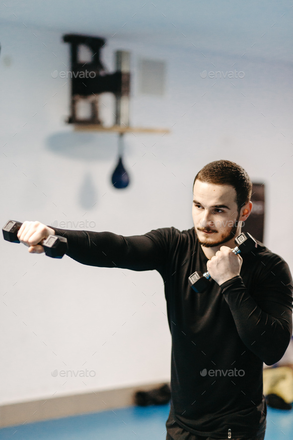 Boxers train in the ring and in the gym Stock Photo by yavorandriy