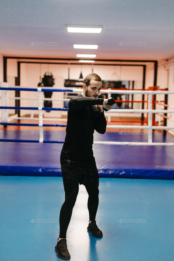 Boxers train in the ring and in the gym Stock Photo by yavorandriy