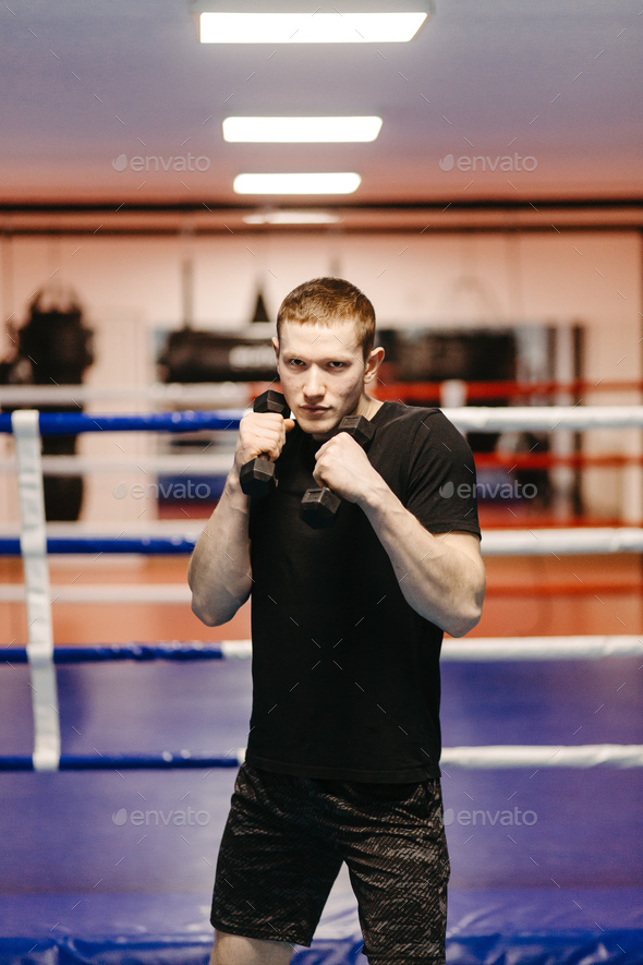 Boxers train in the ring and in the gym Stock Photo by yavorandriy