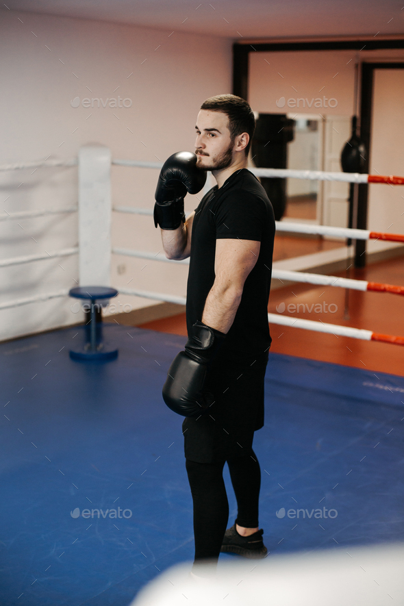 Boxers train in the ring and in the gym Stock Photo by yavorandriy