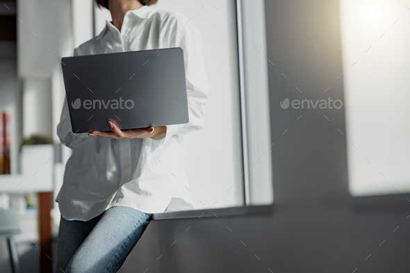 Close up of business woman in casual clothe with laptop standing in modern office