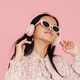 Asian girl dancing while listening music with headphones - PhotoDune Item for Sale