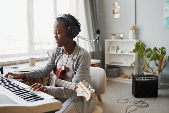 Talented Young Woman Making Music - Stock Photo - Images