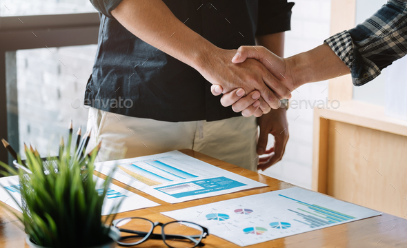 business people handshake for teamwork of business merger and acquisition - Stock Photo - Images