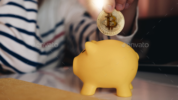 Business woman put bitcoin to piggy bank, bit coin BTC the new electronic money,