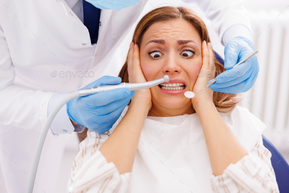 Afraid woman at dentist office