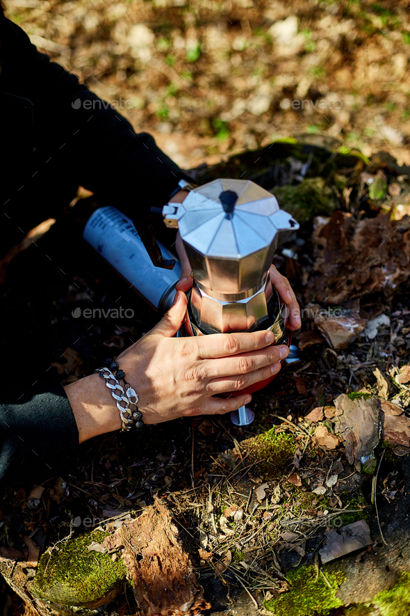 Process of making camping coffee outdoor with metal geyser Stock Photo by  bondarillia